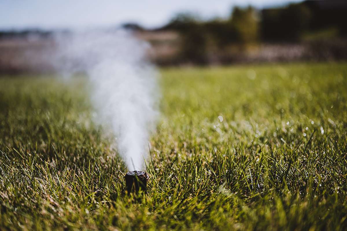 A high-efficiency sprinkler spray head in action.